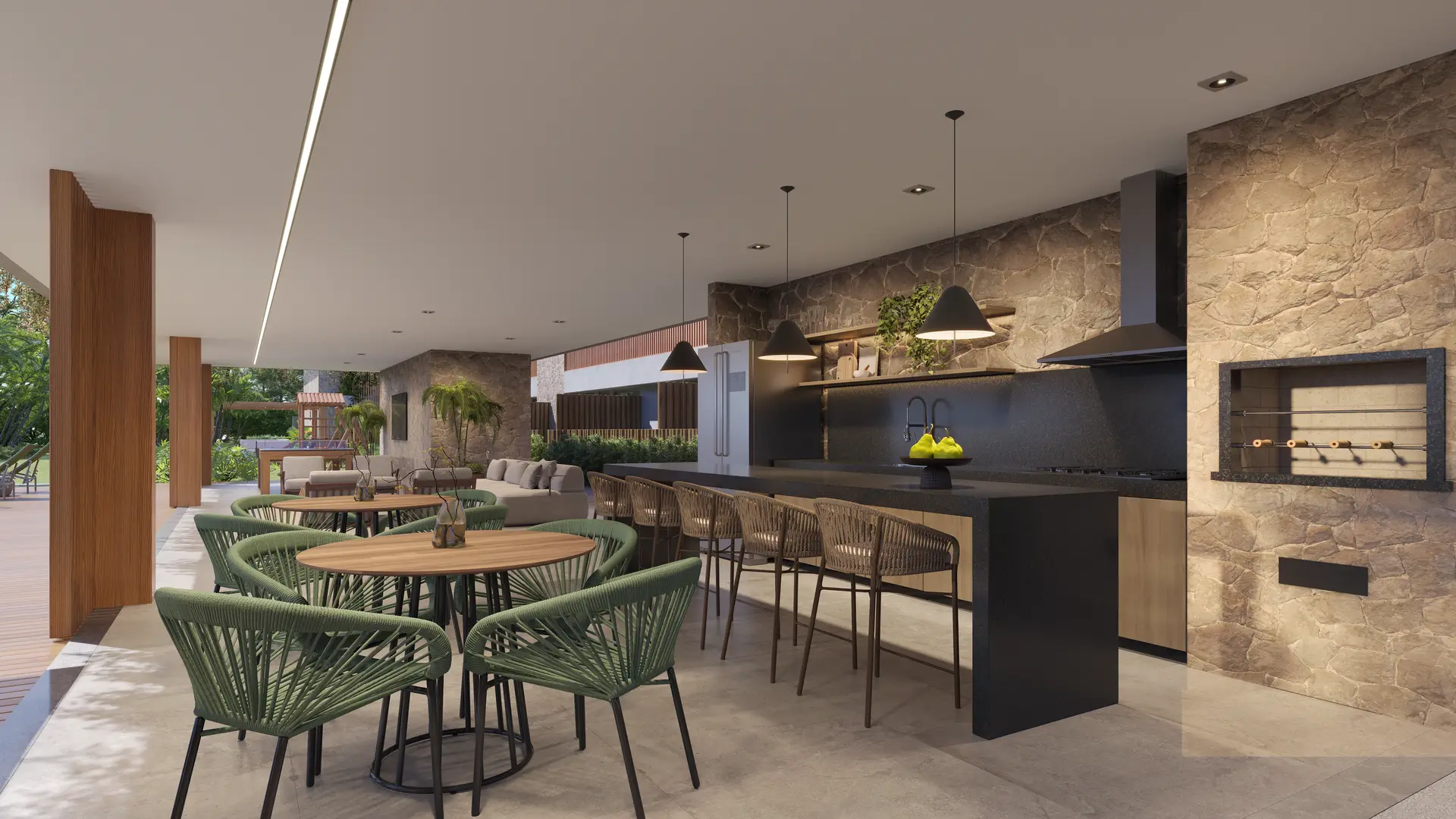 Espaço gourmet com bancada, churrasqueira e mesas