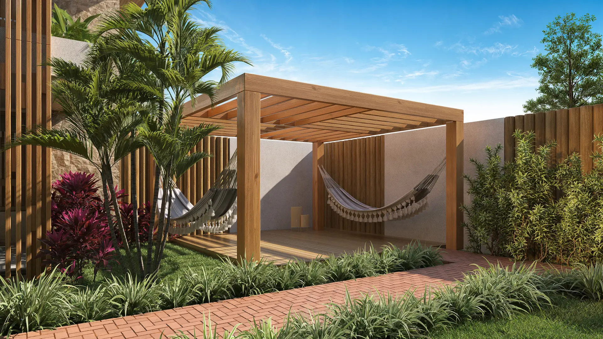 Redário com pergolado de madeira, rede e jardim tropical